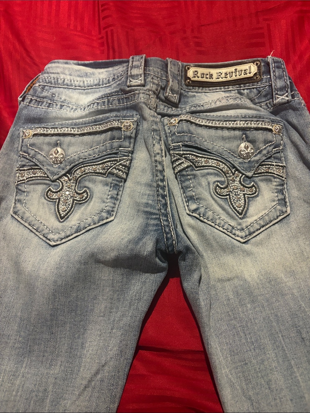Rock Revival Women's Light Blue Distressed Skinny Jeans with Subtle Rips